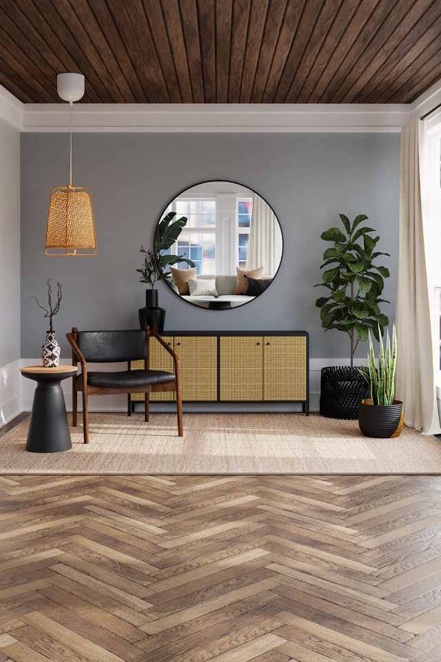 herringbone hardwood in contemporary living room with natural rug and greenery